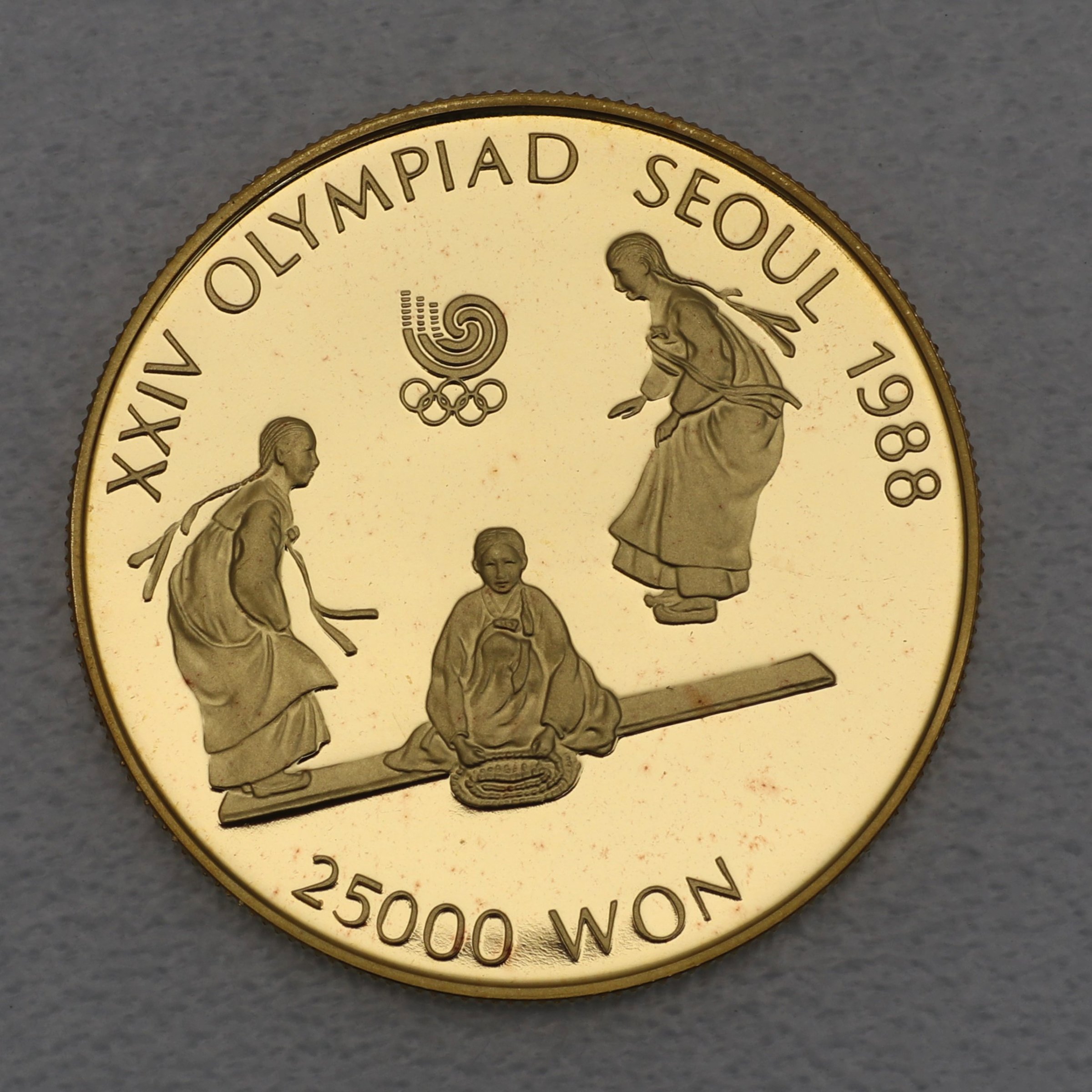 Goldmünze 25000 Won "Seesaw" 1988 24. Olympiade in Seoul 1988 (Südkorea) - Hauptansicht