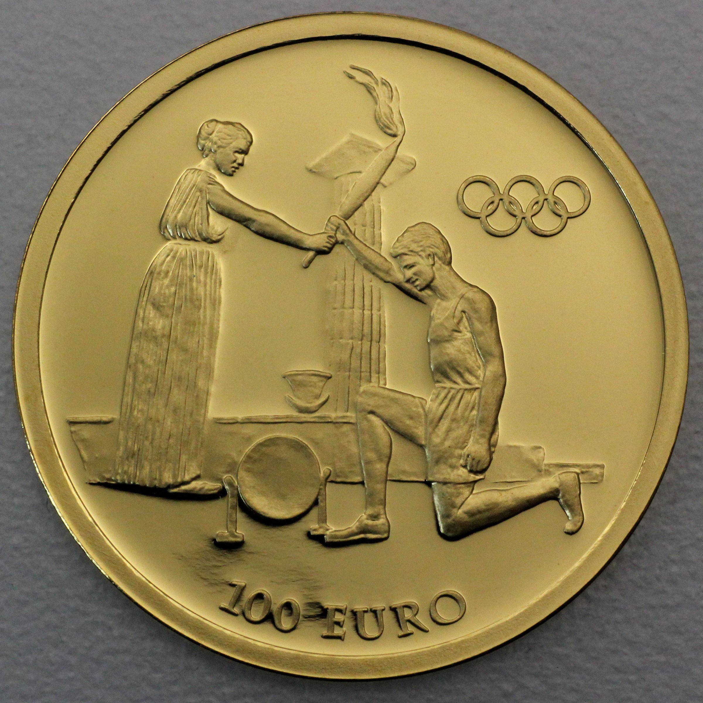 Goldmünze 100 Euro "Fackellauf – Übergabe" 2004 Olympische Sommerspiele Athen 2004 (Griechenland) - Hauptansicht
