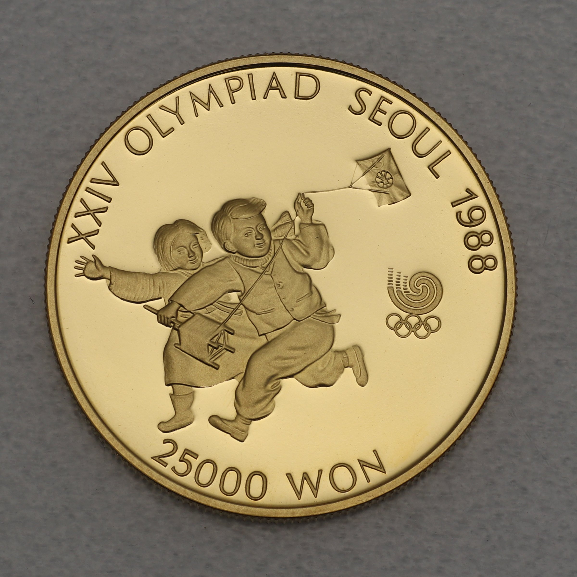 Goldmünze 25000 Won "Kite Flying" 1987 24. Olympiade in Seoul 1988 (Südkorea) - Hauptansicht